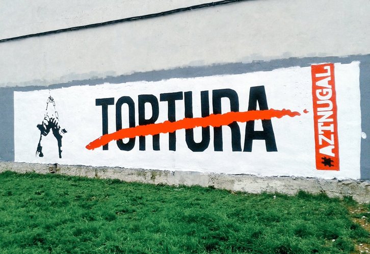 Mural en Burlata para denunciar las torturas contra cinco navarros. 