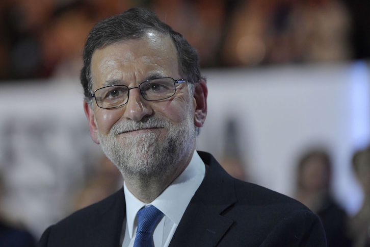 Rajoy satisfecho, tras ser elegido presidente del PP. (Curto DE LA TORRE | AFP)
